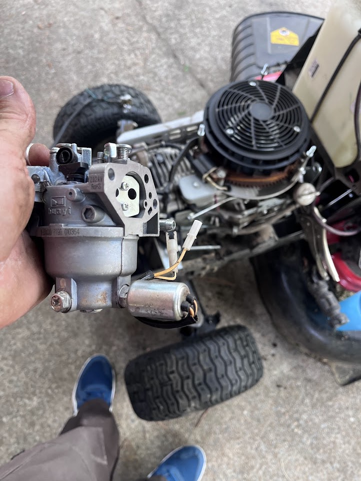 Carburetor removed before reinstalling on a riding mower engine